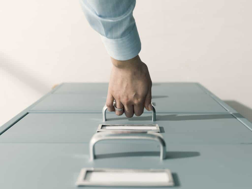 Office Moving 101 2 Secretary searching files in the filing cabinet