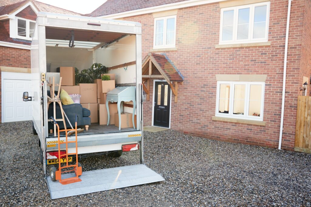 Your Moving Day Survival Guide 3 Removal Truck Waiting To Be Unloaded Outside New Home On Moving Day