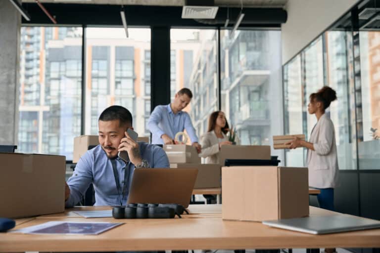 Team of corporate workers preparing for office move