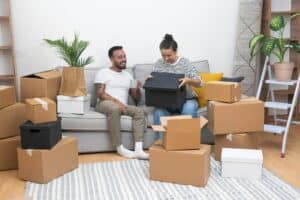 Young woman with lovely husband relaxes celebrating moving